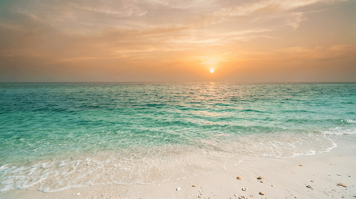 Soft golden light on calm ocean water at dusk, serene horizon